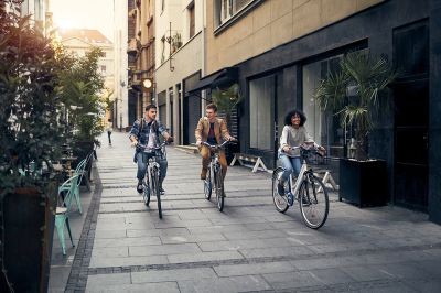 Friends-Riding-Bicycles-In-A-City--