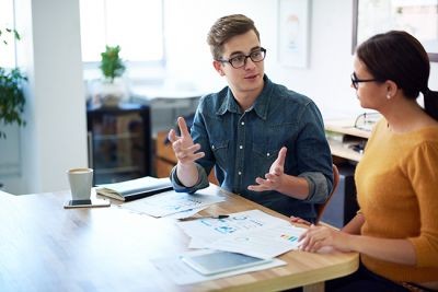 Work-colleagues-chatting-male-and-female