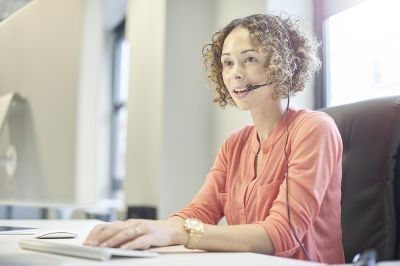 Counselling-woman-on-phone-headset